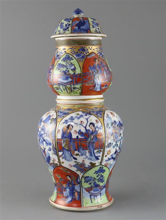 A large Chinese clobbered blue and white double gourd vase and cover, Kangxi period, H.42.5cm, cover repaired, crack to neck